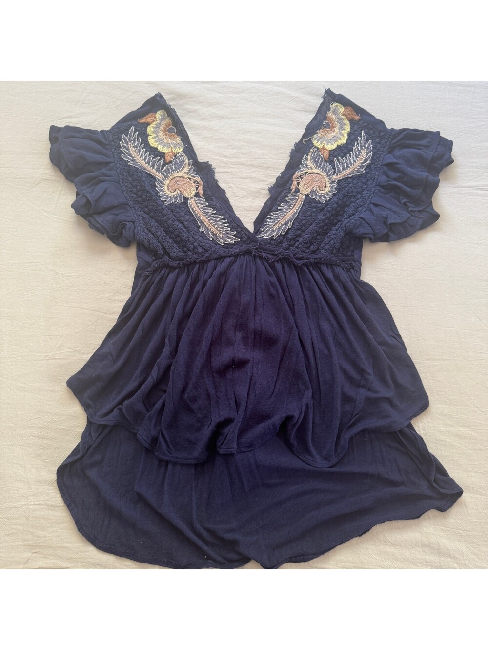 Free People Fiesta Nueva Tunic Blouse XS Navy Embroidered Back Tassel Ruffle